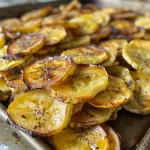 Close-up shot of baked banana chips, showcasing their crispy texture and golden color.