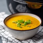 Close-up of creamy mac and cheese in a bowl, showcasing melted cheese and elbow macaroni.