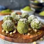 Close-up of Matcha Energy Balls with a textured surface, dusted with coconut flakes.