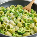 A close-up shot of a bowl of healthy broccoli pasta with a creamy texture and vibrant colors.