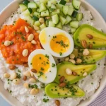 Close-up view of a creamy Crockpot Crab Dip in a rustic bowl, garnished and ready to serve.