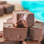 Close-up view of Easy Healthy Fudge with visible texture, set against a blurred background.