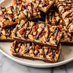 Close-up of dark chocolate sea salt nut bars with a rich, textured surface.