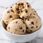 Close-up image of creamy Greek yogurt cookie dough with chocolate chips.