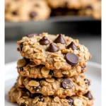 Close-up of a stack of Healthy Banana Oatmeal Cookies with a golden-brown color and chocolate chips.