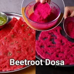 Close-up of a crispy beetroot dosa with a vibrant pink hue, garnished and served on a plate.