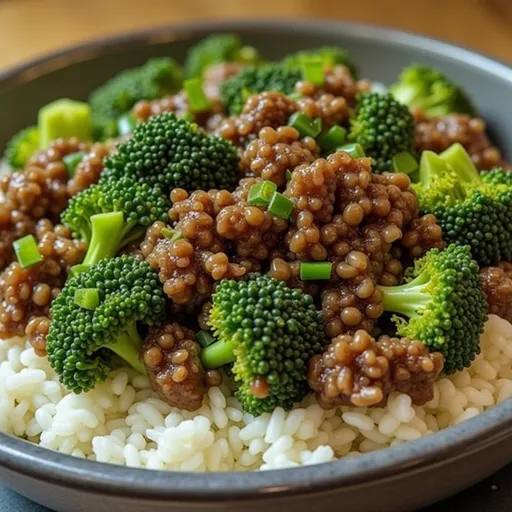 Close-up of honey garlic ground beef and broccoli dish with a glossy texture.