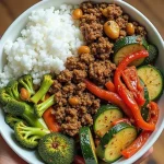 Close-up of a Spicy Ground Beef Stir-Fry Bowl with vibrant vegetables and rice.