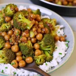 A close-up shot of a vibrant Garlic Broccoli Stir Fry with Chickpeas, showcasing glossy broccoli and golden chickpeas.