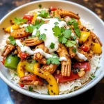 Close-up of spicy shrimp tacos with vibrant toppings on a plate.