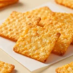 A plate of homemade keto low carb garlic cheddar cheese crisps