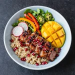 A vibrant bowl of Korean grilled beef bulgogi served with rice and vegetables