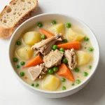 A hearty slow cooker chicken stew filled with vegetables and herbs