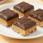 Delicious homemade strawberry oatmeal bars on a wooden table