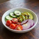 Fresh balsamic cucumber tomato salad in a bowl