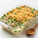 A delicious tuna noodle casserole topped with golden breadcrumbs and parsley