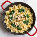 A creamy Boursin chicken pasta dish garnished with fresh parsley